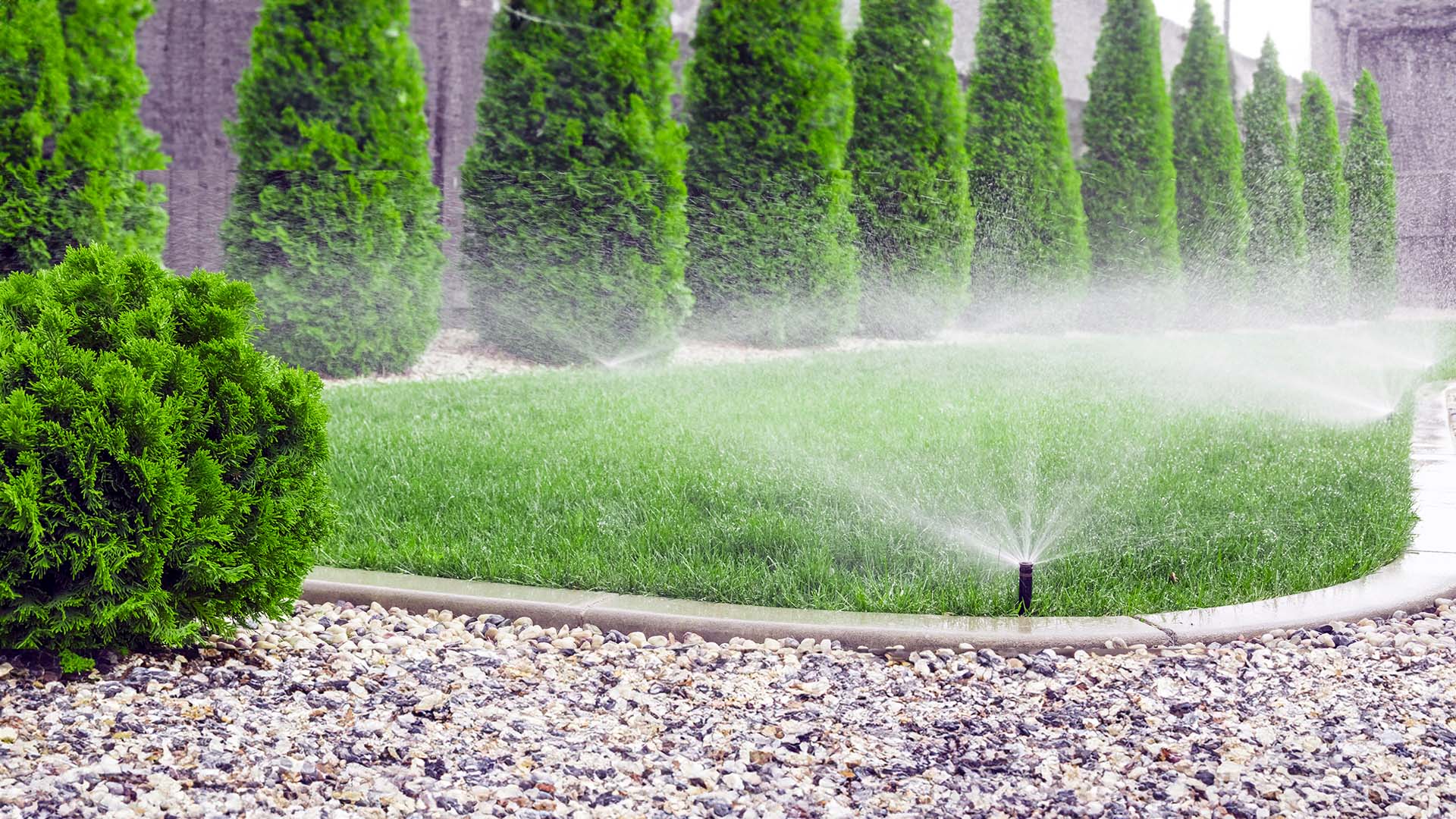 Frequently Asked Questions (FAQs) about Irrigation System Design Sprinkler system watering grass